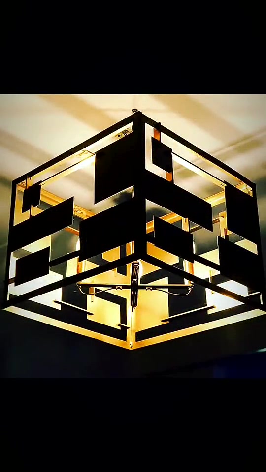 Geometric ceiling light casting a grid of shadows