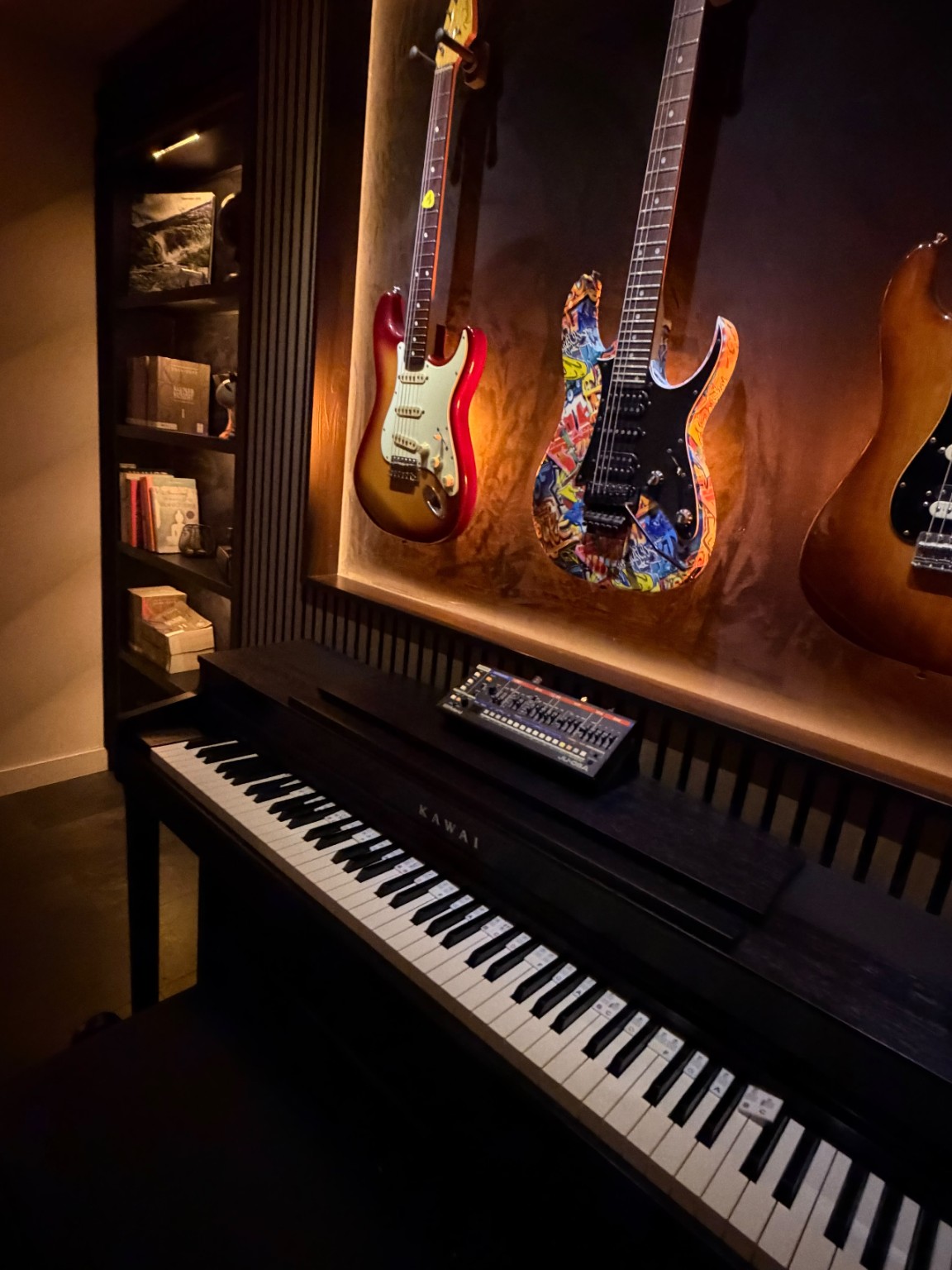 Illuminated guitar display and piano wall
